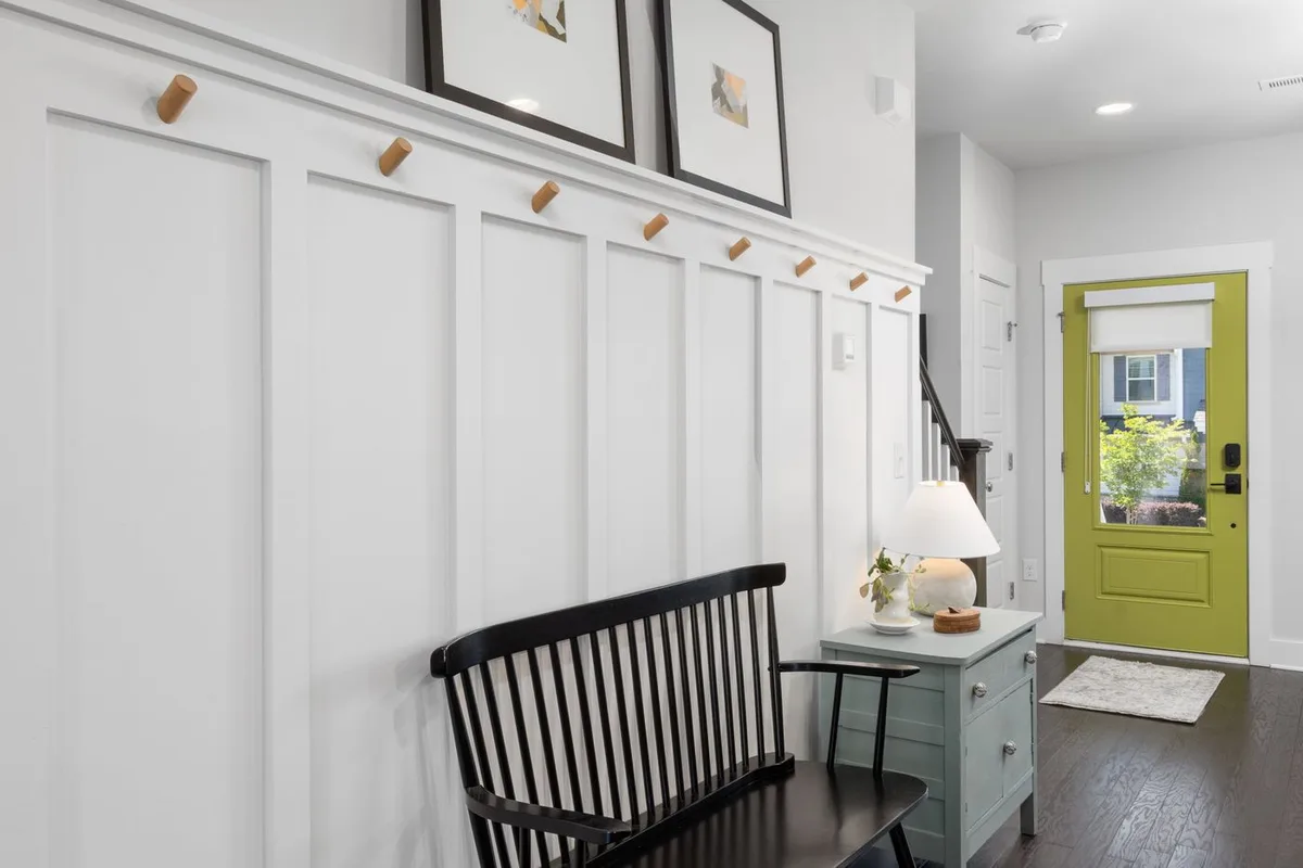 An entryway with seating and storage